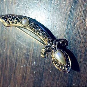 2 Gold vintage brooches - a sword and ladies stiletto in mint condition